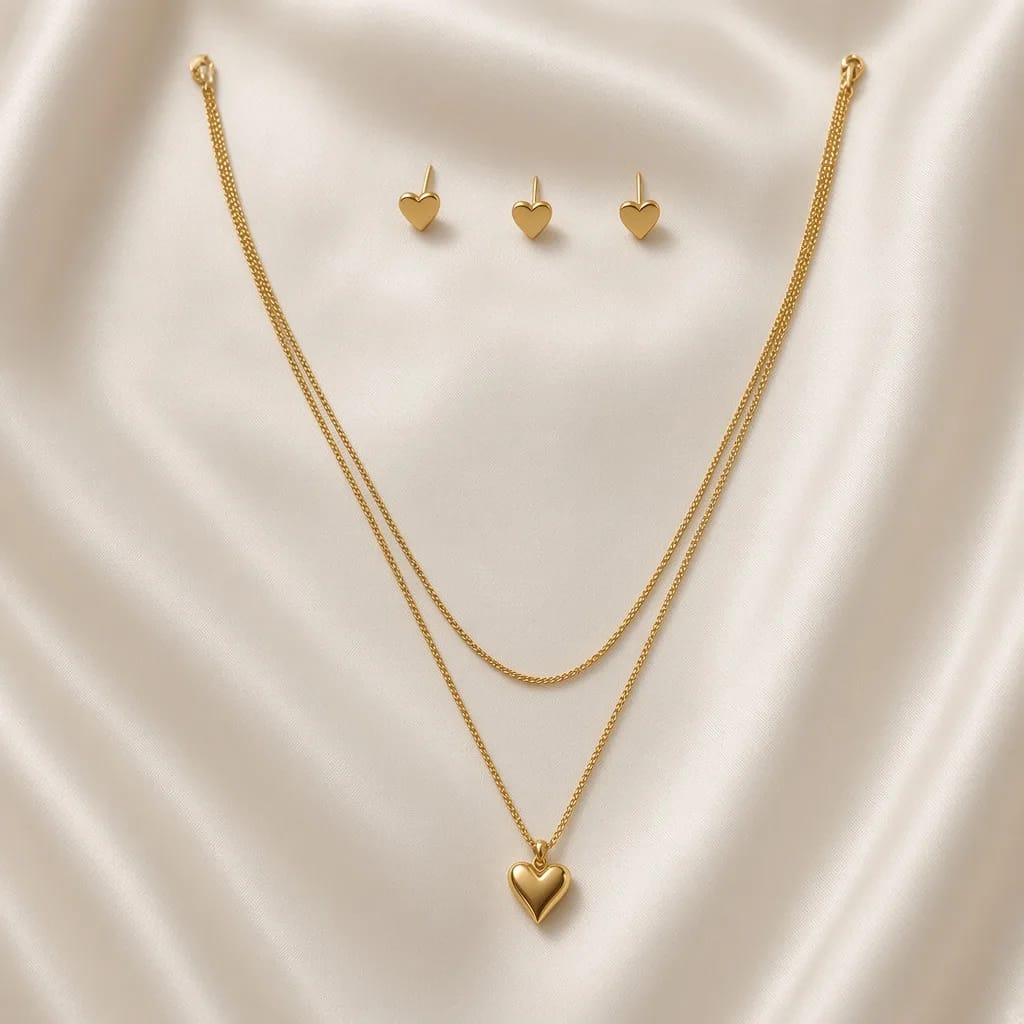 Gold layered necklace with puffy heart pendant and matching heart stud earrings — anti-tarnish set by The Luxe Jewels