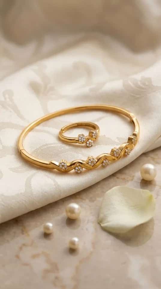 Gold wavy pavé crystal bangle and ring set with S-curve design on fabric